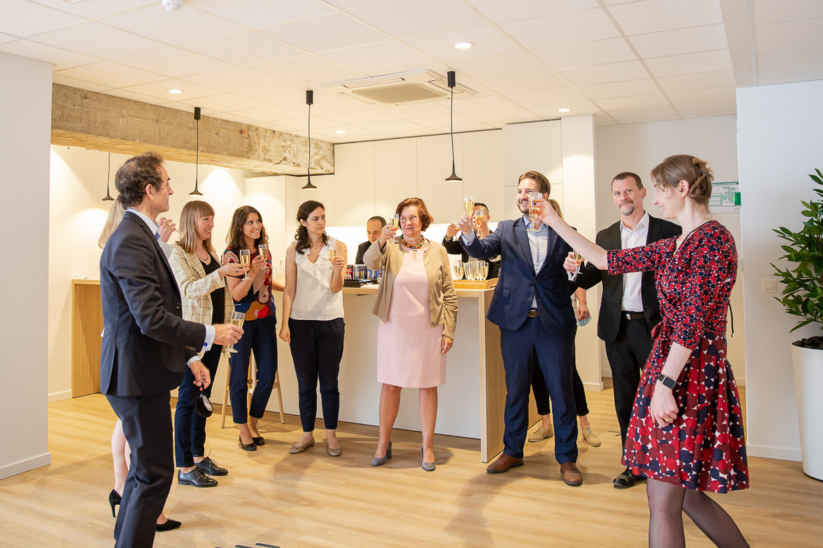 Guests networking and enjoying drinks at a corporate reception in Brussels