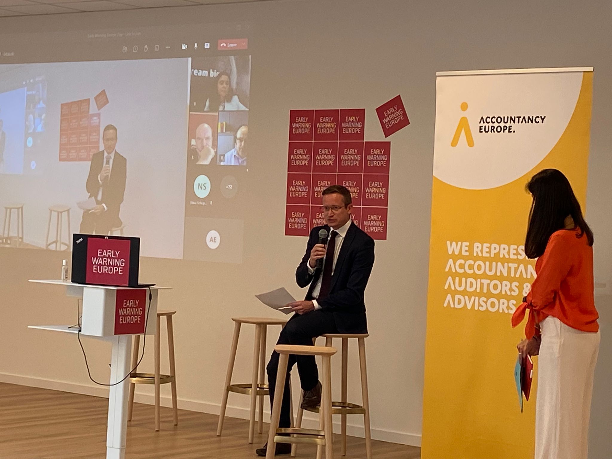 Keynote speaker addressing the audience at a business networking event